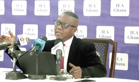 Participants in the press conference. INSET: Dr John K. Kwakye, Director of Research, Institute of Economic Affairs, addressing the press conference. Picture: EDNA SALVO-KOTEY