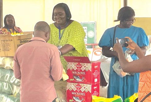 Ms Boadi distributing some items at a charity event
