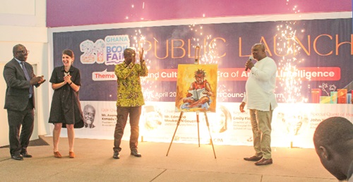 Asare Konadu Yamoah (right), President, Ghana Publishers Association, launching the Ghana International Book Fair. Applauding are Emily Fiagbedzi (2nd from left), Director of Training, Meltwater Entrepreneurial School of Technology, and other dignitaries