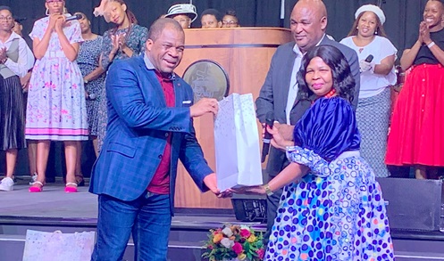 Rev. Stephen Wengam (left), General Superintendent of Assemblies of God, receiving a gift from  Botswana Assemblies of God in Gaborone