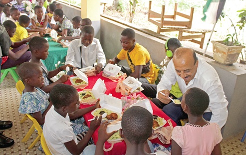  Abdulfatah K. Alsattari (arrowed), Palestinian Ambassador to Ghana, giving food to a beneficiary.  Picture: ERNEST KODZI