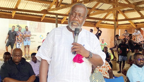 Raymond Nana Damptey, DCE for Birim North, addressing the Akyem Ntronang community members