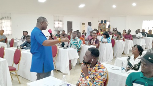 Nelson Owusu Ansah (left), Deputy Chief Executive Officer  of the National Youth Authority, addressing social media youth leaders and influencers at the Koforidua seminar 