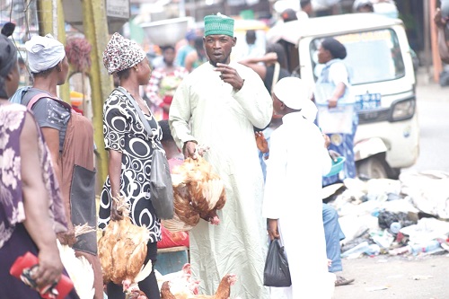 Some Muslims buying fowls at Alabar in Kumasi