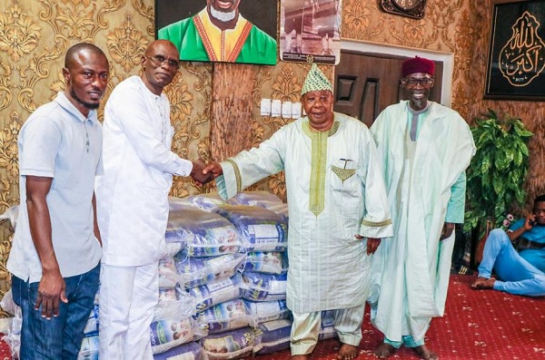 Dr Yakubu Diomande (2nd left), the Export Manager of Latex Foam, presenting the rice to the Protocol Officer of the Chief Imam, Alhaji Latif Abdulsalam. Behind Alhaji  Abdulsalam is Sheik Armiyawo Shaibu, the Spokesperson for the Chief Imam. Standing behind Dr Diomande is a staff from Latex Foam's Sales Department, Salis Nuhu.