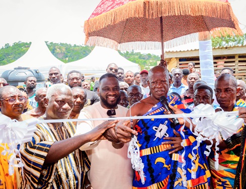 Ohene Kwame Frimpong (middle), CEO, Salt 95.9 Fm, with chiefs and leadership of Asante Akyem Agogo cutting the tape of the two-unit classroom block for the Savior M. A. School. inset: The two-unit classroom block