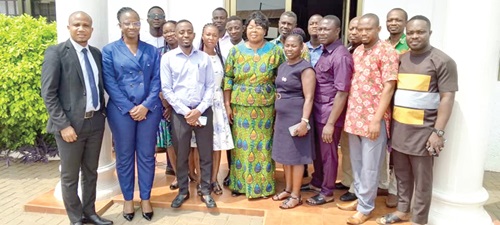 Mabel Lariba Awuni (2nd from left), Legal Officer of the IJM, with Gabriel Acolatsey (left), Senior Manager of the IJM; Evelyn Yawa Bansah (5th from right), Bono East Regional Director of DSW, and the district officers