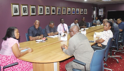 Hollistar  Duah-Yentumi (left), Managing Director of SIC Insurance Company Limited, addressing Ato Afful (2nd from left), Managing Director of Graphic Communications Group Ltd, and his delegation when they paid a visit to SIC Insurance  Company Limited’s head office in Accra. Picture: ESTHER ADJORKOR ADJEI 