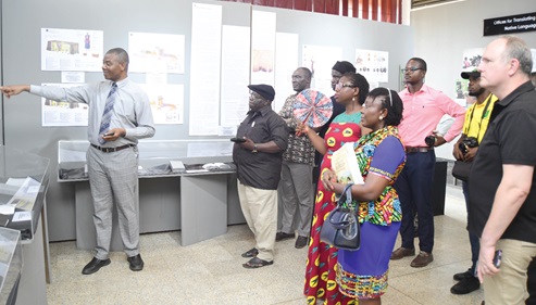 Daniel Ashai Adashie (left), Head of Public Information Department of the Jehovah's Witnesses, Ghana Branch, explaining a point to visitors at the ongoing exhibition at the National Museum in Accra. Picture: Emmanuel Quaye
