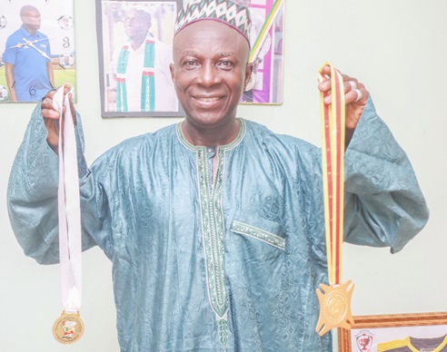 Counting his blessings :  Coach Basigi as part of his thanksgiving to Allah, went for the Eid ul Fitr prayers with his two  African Games gold medals won in 2015(right)  and 2023