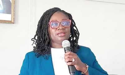 Kosi Yankey-Ayeh (left), Chief Executive Officer of Ghana Enterprise Development Agency, addressing traders of the Koforidua Beads Market