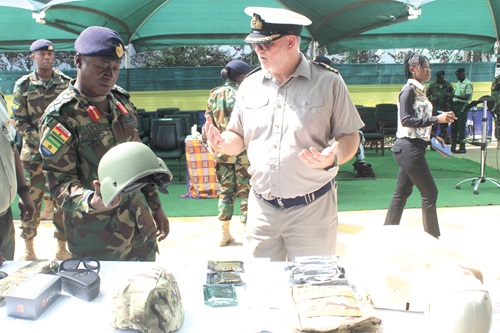Commander Richard Walters (right), British Defence Attache to Ghana, explaining a point to Major General Bismarck Kwasi Onwona (left), Chief of Army Staff of the Ghana  Armed Forces, after the presentation. Picture: ESTHER ADJORKOR ADJEI 