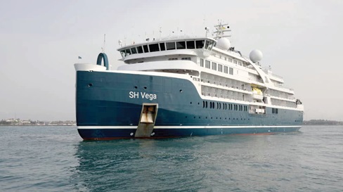 The SH Vega. INSET: Some of the crew at the port