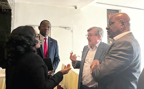 Ellen Ohene-Afoakwa (left), Managing Executive, Corporate and Investment Banking at Absa Bank Ghana, and Adolph Kpegah (2nd from left), MD, Absa Bank Ghana, in a chat with some guests at the forum