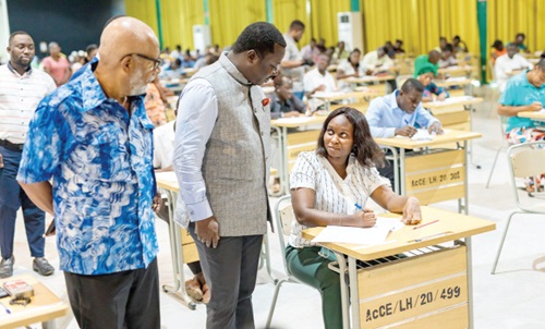 Rev. John Ntim Fordjour (2nd from left), a Deputy Minister of Education, accompanied by Anis Haffar (left), Chairman of the National Teaching Council, during the 2024 Ghana Teacher Licensure Examination at the Accra College of Education