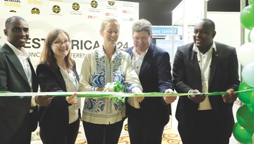 Sivine Jansen (3rd from left), Deputy Head of Mission, German Embassy in Ghana, cutting a tape to open the ICCX West Africa 2024 International Concrete Conference and Exhibition. Those with her are Dr Holger Karutz (2nd from right), Managing Partner, ad-media GmbH; Kwadwo Botuo Gyimah (right), Sector Expert Construction/Ghana; Richard Ekow Mensah (left), Head of DEinternational Services and Key Account Management Department, Delegation of German Industry and Commerce in Ghana, and Peggy Schulz (2nd from left), Deputy Head of Division, Sub-Saharan Africa, Federal Ministry for Economic Affairs and Climate Action. Picture: EDNA SALVO-KOTEY