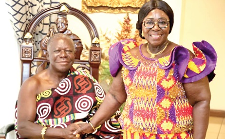 Otumfuo Osei Tutu (left), Asantehene, exchanging pleasantries with Akosua Frema Osei-Opare, Chief of Staff at the Office of the President