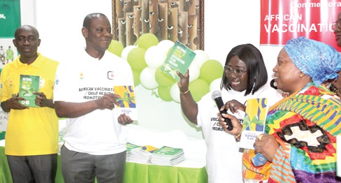 Akosua Frema Osei-Opare (2nd from right), Chief of Staff; Nana Amponsah Dokua III (right), Paramount Queen Mother of Osu Doku Traditional Area; Dr Patrick Kuma-Aboagye (2nd from left), Director-General, GHS, and Dr Franklin Asiedu-Bekoe (left), Director of Public Health, GHS, jointly launching  the COVID-19 Integration Plan and Vaccine Related Events Response Plan in Accra.  Picture: ESTHER ADJORKOR ADJEI