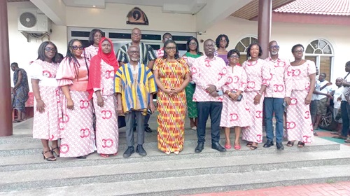 Kathleen Addy (in Kente), Chairperson, NCCE, and some leadership and staff. Those with them include, Samuel Asare Akuamoah (4th from left), Deputy Chairman of Operations, NCCE, in Kumasi