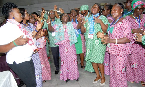 Prof. Alice Constance Mensah (middle), Dean of Faculty of Applied Sciences, ATU, singing and dancing with TEWU members at the conference