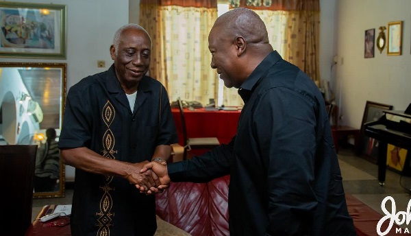 Former President John Dramani Mahama (right) with the father of the late Mawuena Dumor Trebarh, Professor Ernest Dumor
