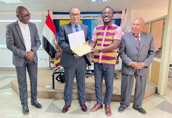 Daily Graphic’s Emmanuel Ebo Hawkson (2nd right), receiving his certificate from Saleh El Salhi, Deputy President of the Supreme Council for Media Regulations from Egypt. Looking on is Edmund Kofi Yeboah (left), General Secretary of the GJA and Ambassador Ahmed Haggag, a former Ambassador of Egypt to Kenya .