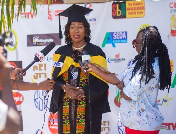 Mrs  Gladys Desbordes-Hill being interviewed after her graduation 