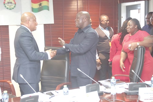  Samuel Abu Jinapor (2nd from left), Minister of Lands and Natural Resources, interacting with Samuel Okudzeto Ablakwa (right), Member of Parliament, North Tongu and Chairman of the Committee, after the meeting in Parliament. Picture: ELVIS NII NOI DOWUONA 