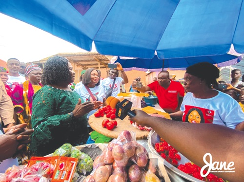 Prof. Opoku-Agyemang interacting with some traders at Mfuom in the Upper Denkyira East constituency