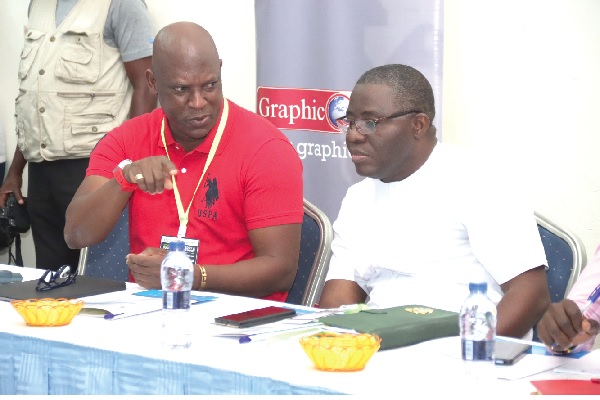 Ato Afful (left), Managing Director, GCGL, interacting  with John Kobina Abbam Aboah Sanie (right), Deputy Minister of Energy, during the Africa Energy and Sustainability Summit. Picture: ELVIS NII NOI DOWUONA 