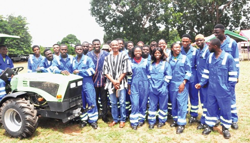 Steven Odarteifio (arrowed), Coordinator, Sustainable Food System, WFP, and William Dzamefe (in smock), Volta Regional Director of Agriculture, with some of the trainees