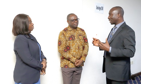 Peter Yaro (middle), Executive Director, BasicNeeds Ghana; Dr Susan Seffah (left), Psychiatrist, Mental Health Authority, and Samuel Hackman (right), Executive Secretary, Country Coordinating Mechanism Ghana, in a discussion during the meeting. Picture: EDNA SALVO-KOTEY