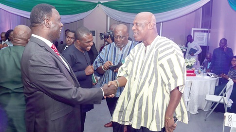  Dr Yaw Osei Adutwum (left), Minister of Education, interacting with Ato Afful, Managing Director, Graphic Communications Group Ltd, after the Think Energy SDG Awards ceremony in Akosombo