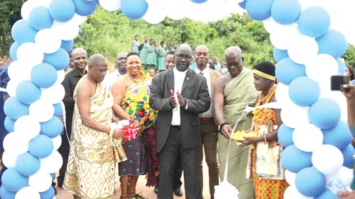 Very Rev. Solomon Sobeng (middle), Diocesan Synod Secretary of the Methodist Church Ghana, being assisted by Nana Barima Ekow Gyesa II (2nd from right), acting President of the Sekondi Traditional Council, to cut the tape to inaugurate the building. INSET: The main dormitory block