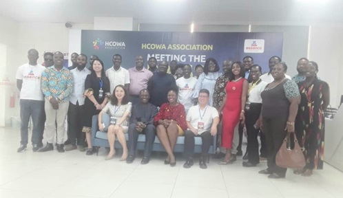  Anna Jiang (seated left), CEO, HCOWA association; Harrison Kofi Abutiate (2nd from left), Chairman, National Executive Council, and some participants after the inauguration of the association
