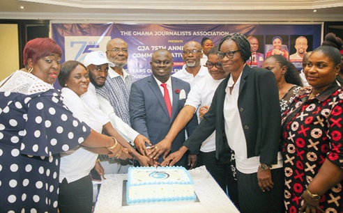  Albert Kwabena Dwumfour (middle), President of the Ghana Journalists Association, Peter Agbeko (4th from right), GJA Executive member, Kobby Asmah (3rd from right), former Editor, Graphic, and other dignitaries cutting the 75th anniversary cake. Picture: CALEB VANDERPUYE