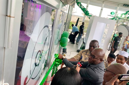 Andrew Egyapa Mercer, Minister of Tourism, Arts and Culture, cutting the tape to the 1,000-seater pavilion. Looking on are Yusuf Olela, Group General Manager of Alisa Hotels, and Kwame Ofosu Bamfo, the  Chairman of the Bamson Group
