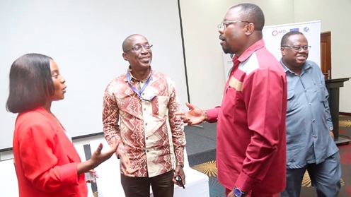  Doris Edem Agbevivi (left), Project Coordinator, Drive Electric Initiative, Energy Commission, interacting with Kofi Agyarko (2nd from left), Director, Renewables and Energy Efficiency, Energy Commission, after the opening session of the EV consultative meeting. With them is Robert B. M Sogbadji (2nd from right), a Deputy Director, Power. Picture: SAMUEL TEI ADANO