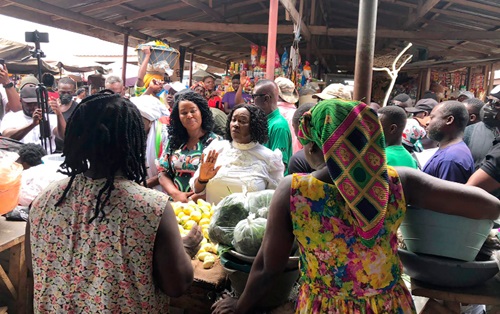 Prof Naana Jane Opoku-Agyemang (arrowed), running mate to the flag bearer of NDC,  with Ewurabena Aubynn, the NDC Parliamentary Candidate for the Ablekuma North Constituency, interacting with some market women
