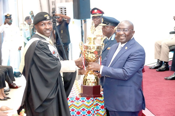 Dr Mahamudu Bawumia, Vice-President, presenting the overall best student award to Maj. Eric Kuudogrme (left), Ghana Army. Picture: ELVIS NII NOI DOWUONA 