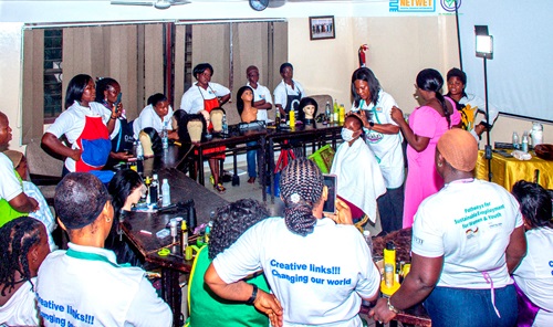 Members of NETWET who are into hairdressing undergoing training