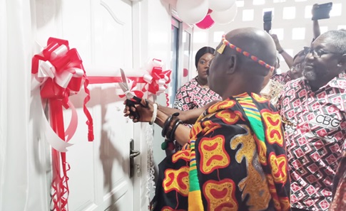Nana Acheampong Otu Agyemfra, the Chief of Larteh Kubease, and Daniel Wilson Addo, Managing Director/ CEO of Consolidated Bank Limited, cutting the ribbon to inaugurate a new laboratory at Larteh Health Centre