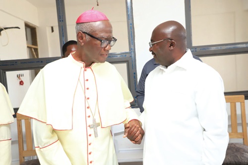 Most Rev. John Bonaventure Kwofie, the Catholic Archbishop of Accra, interacting with Dr Mahamudu Bawumia, the Vice-President, at the project  site