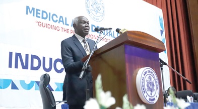 Prof. Paul. K. Nyame (left), Chairman, Medical and Dental Council, Ghana, administering the Physician Assistants Oath to the newly qualified medical and dental practitioners in Accra. Picture: EDNA SALVO-KOTEY 