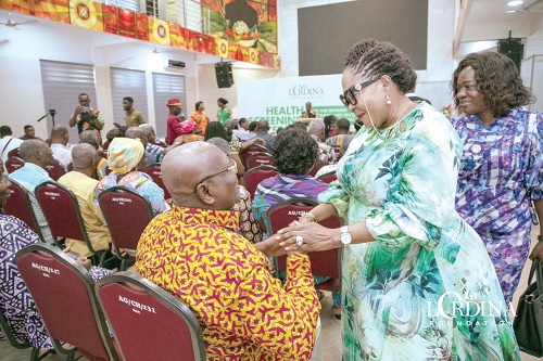 Lordina Mahama, former First Lady, interacting with one of the beneficiaries