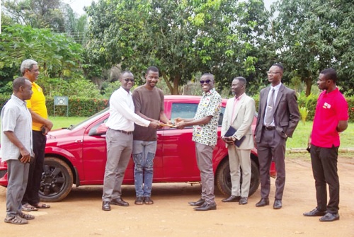 Abdul Samad Nurudeen (4th from left) presenting the vehicle document and keys to Prof. Daniels Obeng-Ofori, Vice-Chancellor of the Catholic University of Ghana