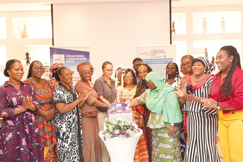  Participants cutting a cake to celebrate AWLN’s  2nd anniversary. Picture: EDNA SALVO KOTEY 