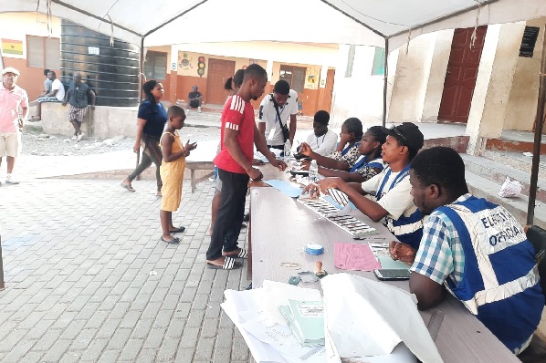 Election officials attending to voters at the Odorkor Primary 2 Polling Centre in the Ablekuma North Constituency