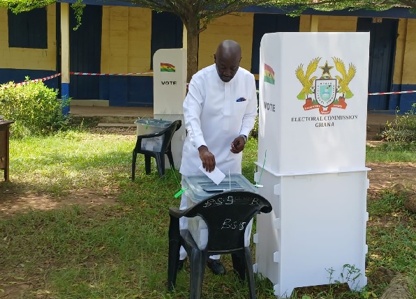 Nana Osei-Adjei, NPP Parliamentary Candidate for New Juaben North putting the ballot into the ballot box