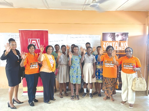  Merley Wood (2nd from left), President of Zonta Club of Accra II, and some members of the club with pupils of the Abelemkpe Cluster of Schools pledging their support to end gender-based violence